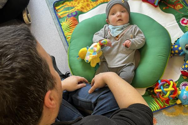 dad and baby playing