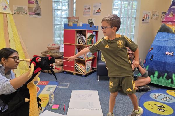 boy playing magic tricks