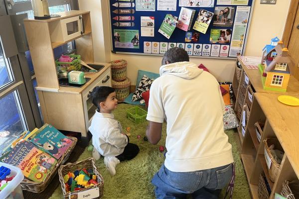 Fhubs worker playing with child