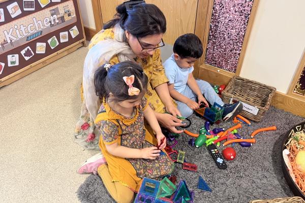 Mom and children playing